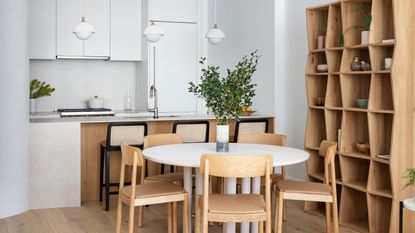 A dining room with round dining table