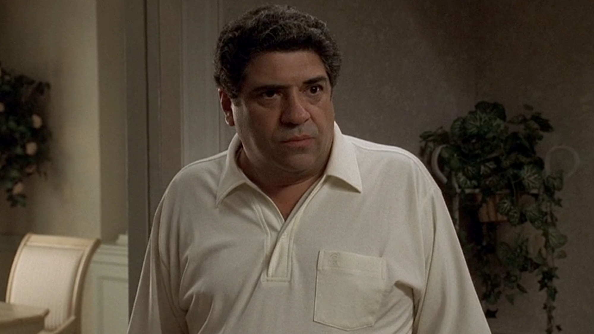 Salvatore Bonpensiero (Vincent Pastore) looks ahead during a conversation on The Sopranos.