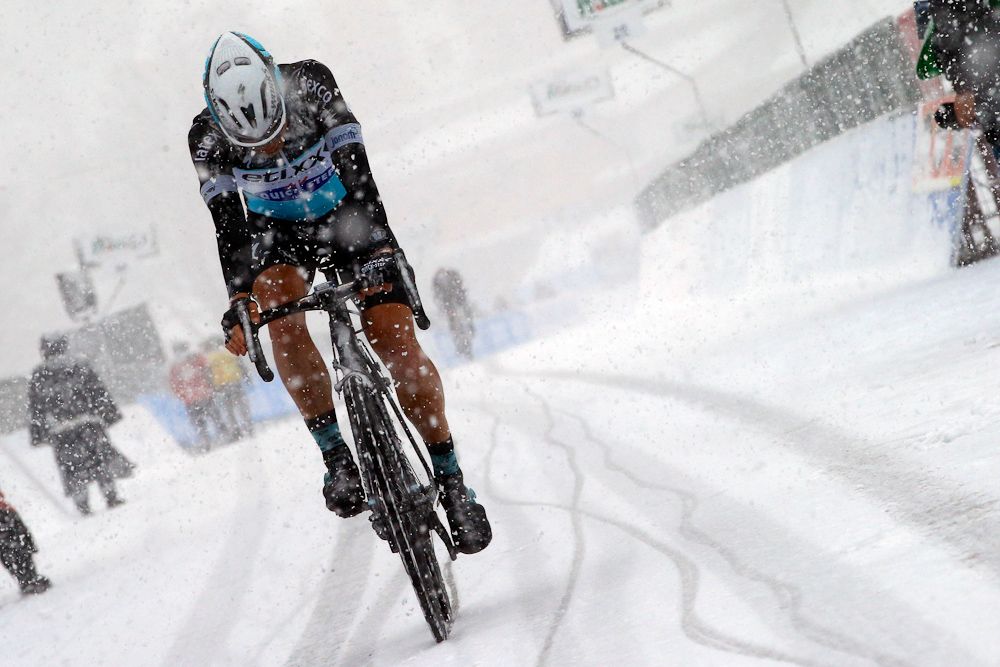 A riders finishes in the snow.