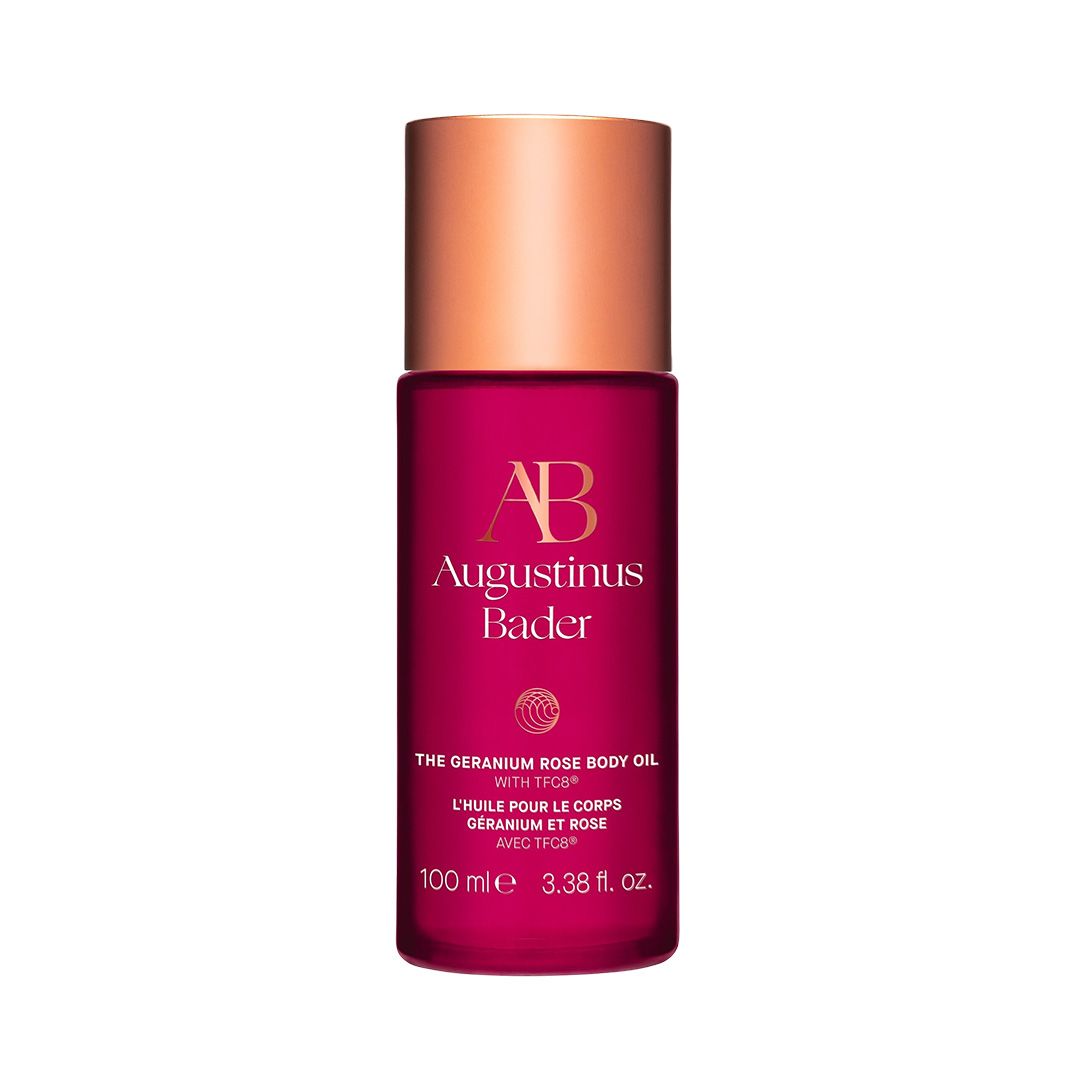 rose body oil in a pink bottle with gold cap