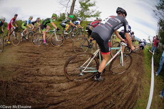 The women's field negotiate a section of mud soon after the start