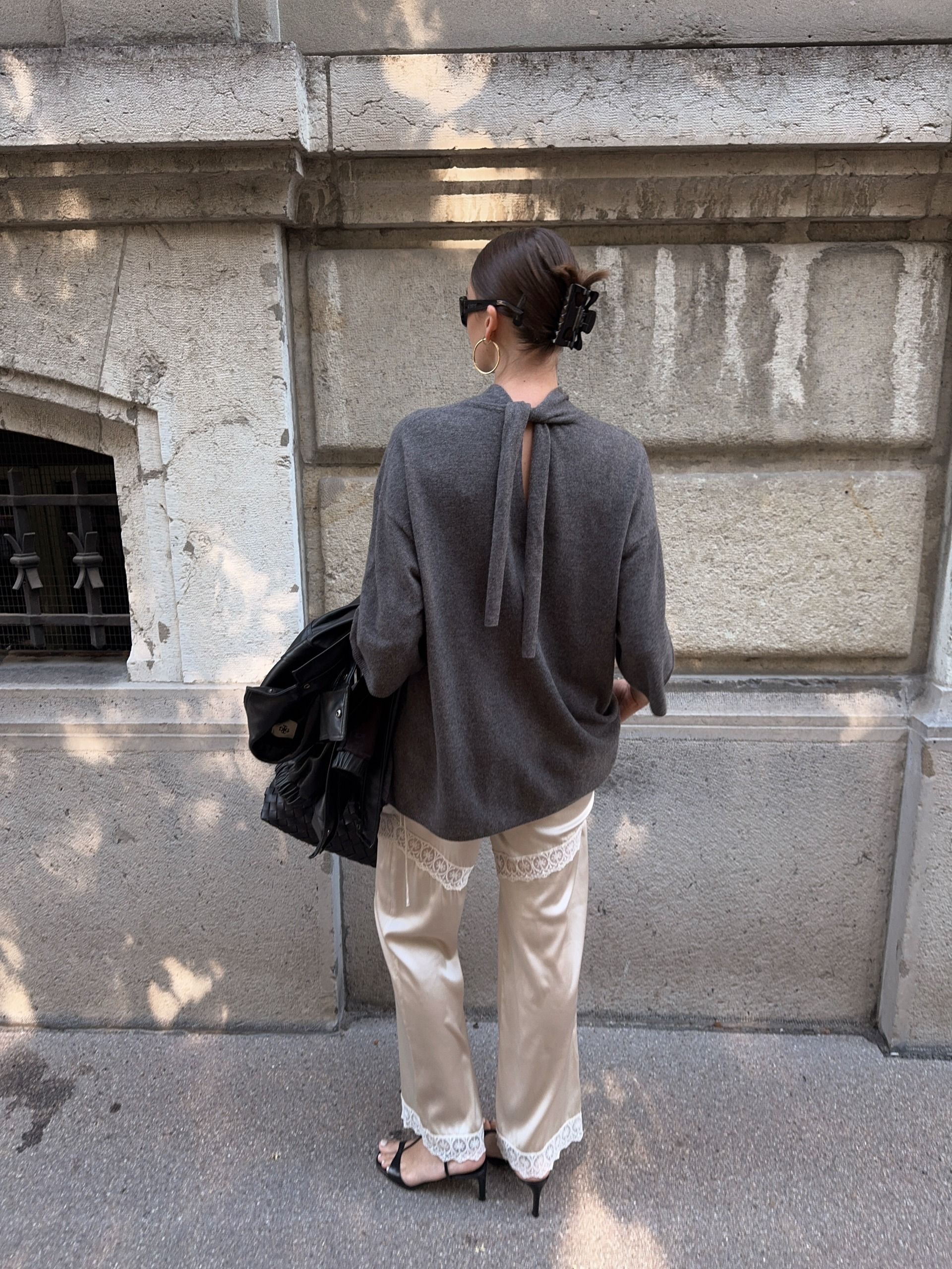 A woman wearing a fall sweater outfit in 2026.