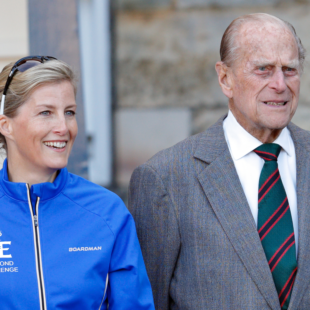 Duchess Sophie wearing a blue jacket standing next to Prince Philip 
