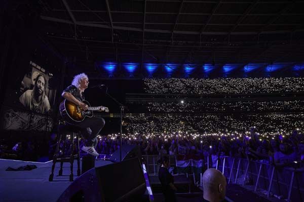 Brian May on a stool