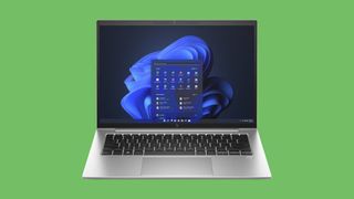 HP EliteBook 1040 G10 laptop against a green background