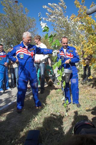 astronaut Owen Garriott assists his son, Richard Garriott