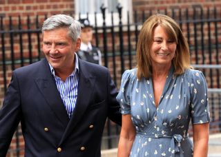 Michael and Carole Middleton depart after visiting the Duke and Duchess of Cambridge and their newborn baby son at the Lindo Wing, St Mary's Hospital on July 23, 2013 in London, England