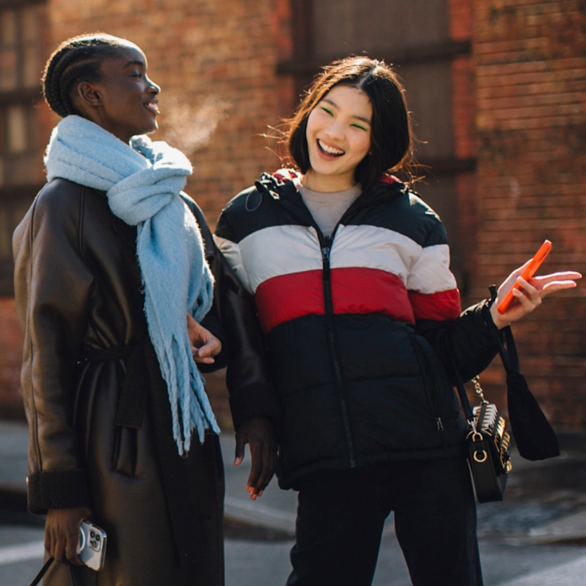woen wearing jackets and scarves 