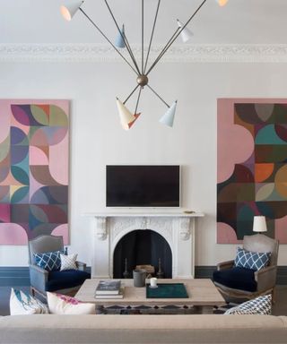 Neutral white living room with large colorful geometric prints