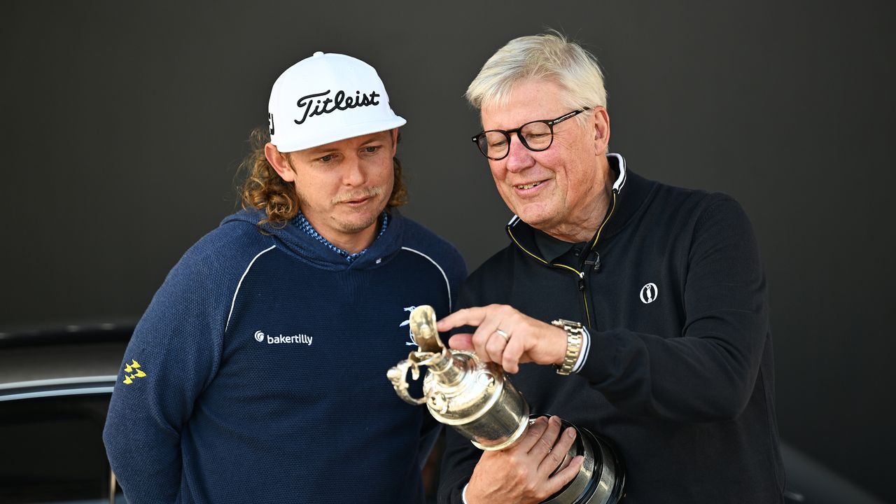 Cameron Smith of Australia arrives with the Claret Jug Trophy and poses with Martin Slumbers, Chief Executive of the R&amp;A prior to The 151st Open at Royal Liverpool Golf Club