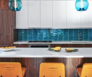 white and wooden kitchen with blue subway tiles