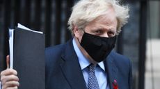 Boris Johnson leaves Downing Street for parliament for the vote on the new UK tier system
