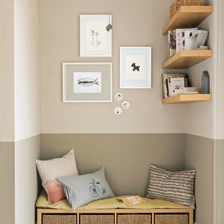 Neutral alcove with bench seating and art on wall