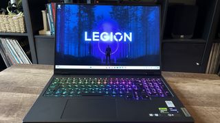 Lenovo Legion Pro 7i gaming laptop open on a wooden table