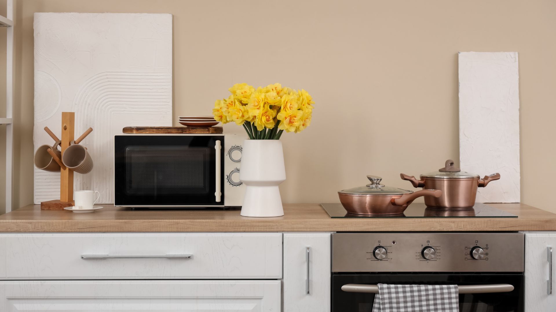 Where should a microwave be placed in the kitchen?