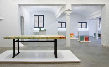Furniture constructed with blocks of wood that are coloured from within.