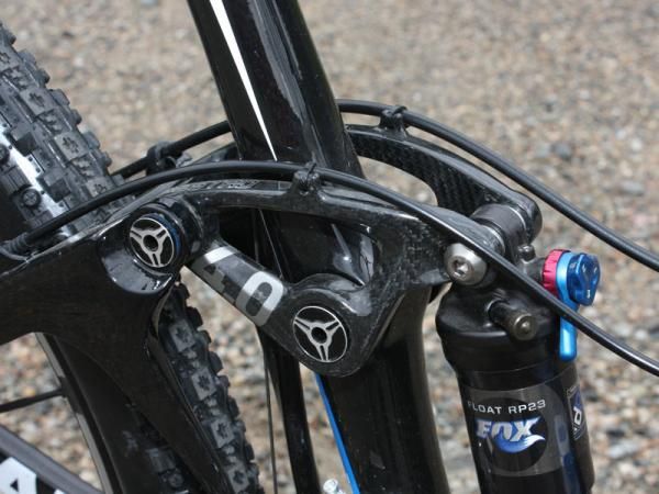 A new carbon fiber upper link has molded in loops to attach the rear derailleur cable housing and rear brake lines.