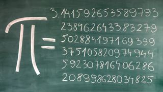 Hand-written Pi numbers on green chalkboard_domin_domin via Getty Images