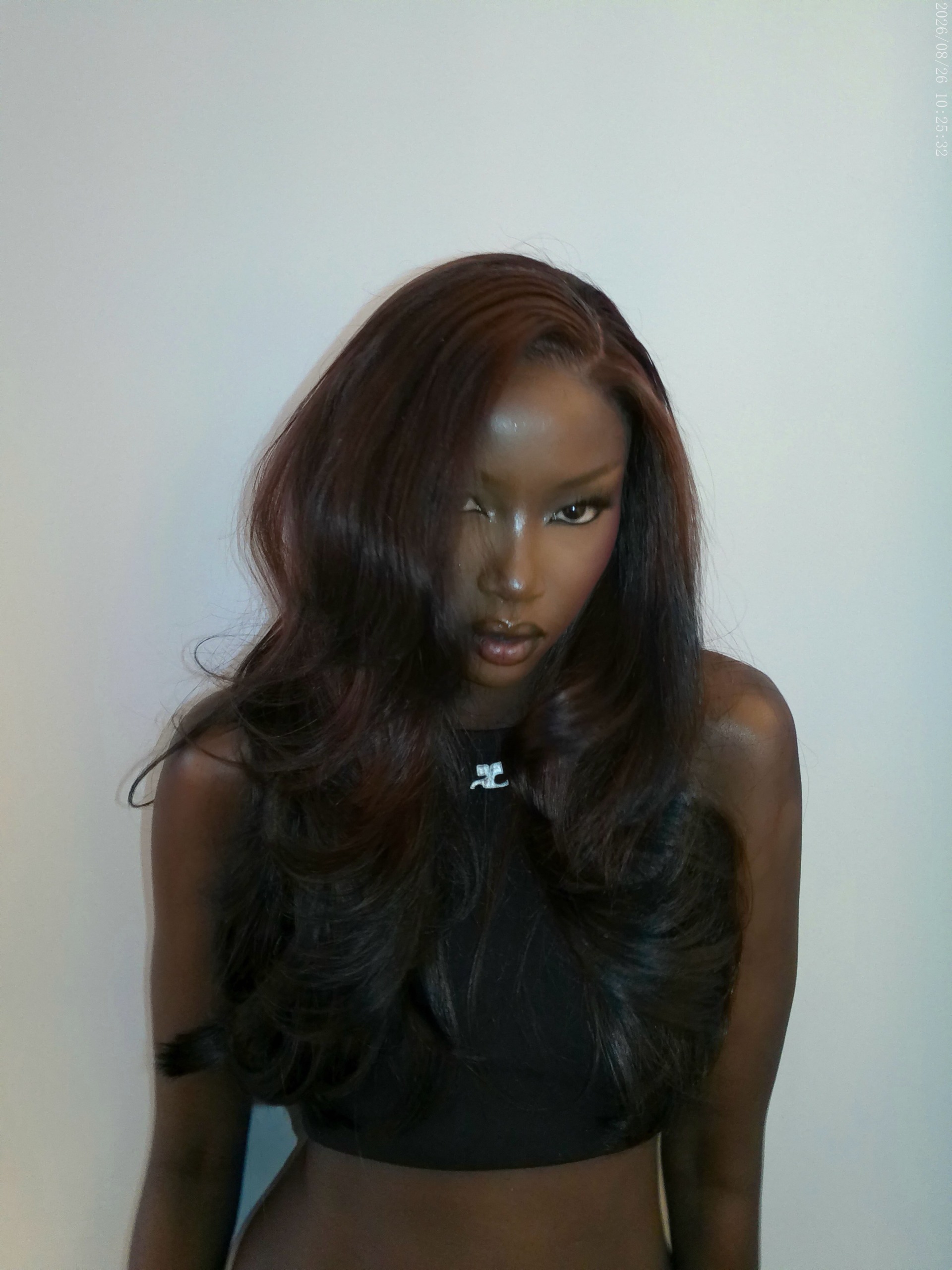 Anok Yai with brown hair.