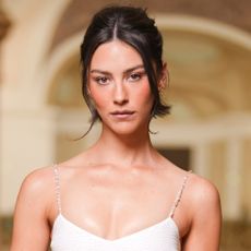 Gracie Abrams attended the Chanel Haute Couture show in a little white dress.