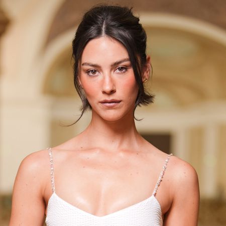 Gracie Abrams attended the Chanel Haute Couture show in a little white dress.