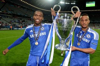 Daniel Sturridge (L) and Ryan Bertrand of Chelsea celebrate with the trophy following their team's victory at the end of the UEFA Champions League Final between FC Bayern Muenchen and Chelsea at the Fussball Arena München on May 19, 2012 in Munich, Germany.