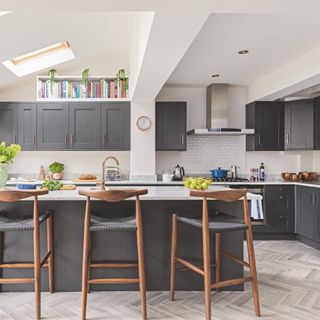 kitchen extension with grey kitchen units and wooden bar stools