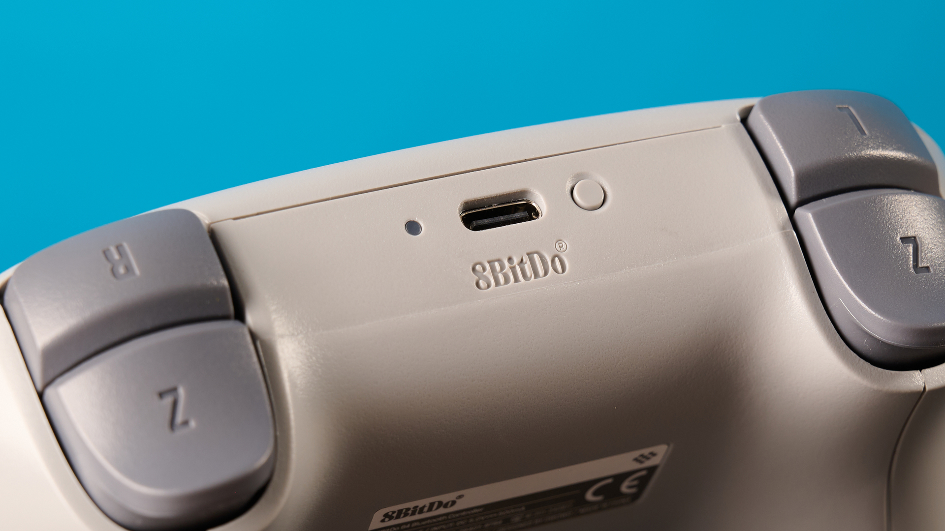 The 8BitDo 64 Controller against a blue background