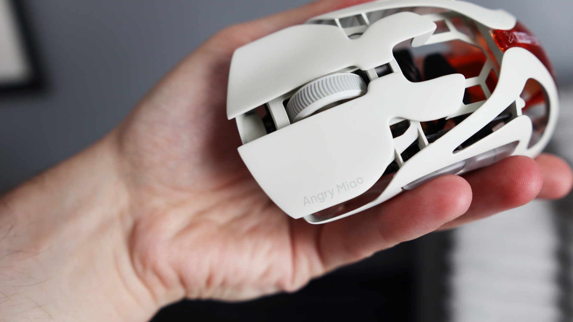 The AngryMiao AM Infinity.97 gaming mouse in hand for testing.