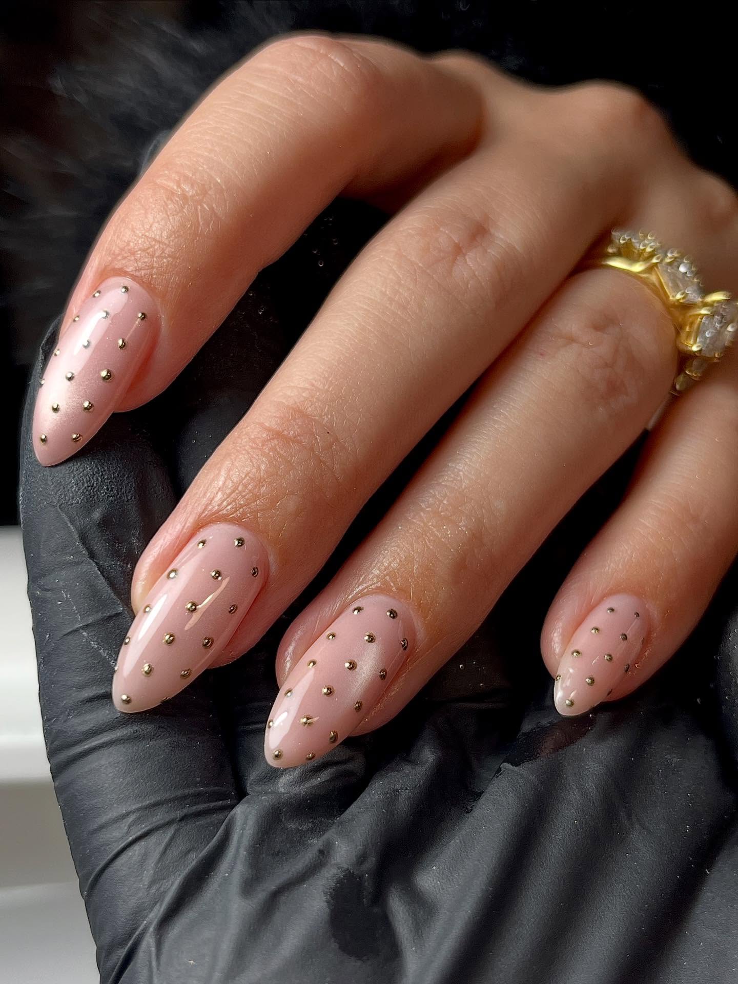 Polka dot studded nails.