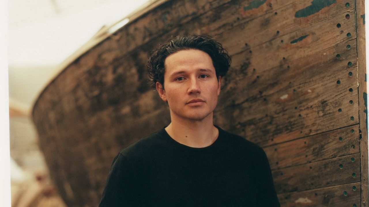 Emerging designer Marc Sweeney, photographed by Norman Wilcox-Geissen, in his father’s boatyardin Loch Lomond, with his ‘Pylon’ spun aluminium candleholders @marc__sweeney