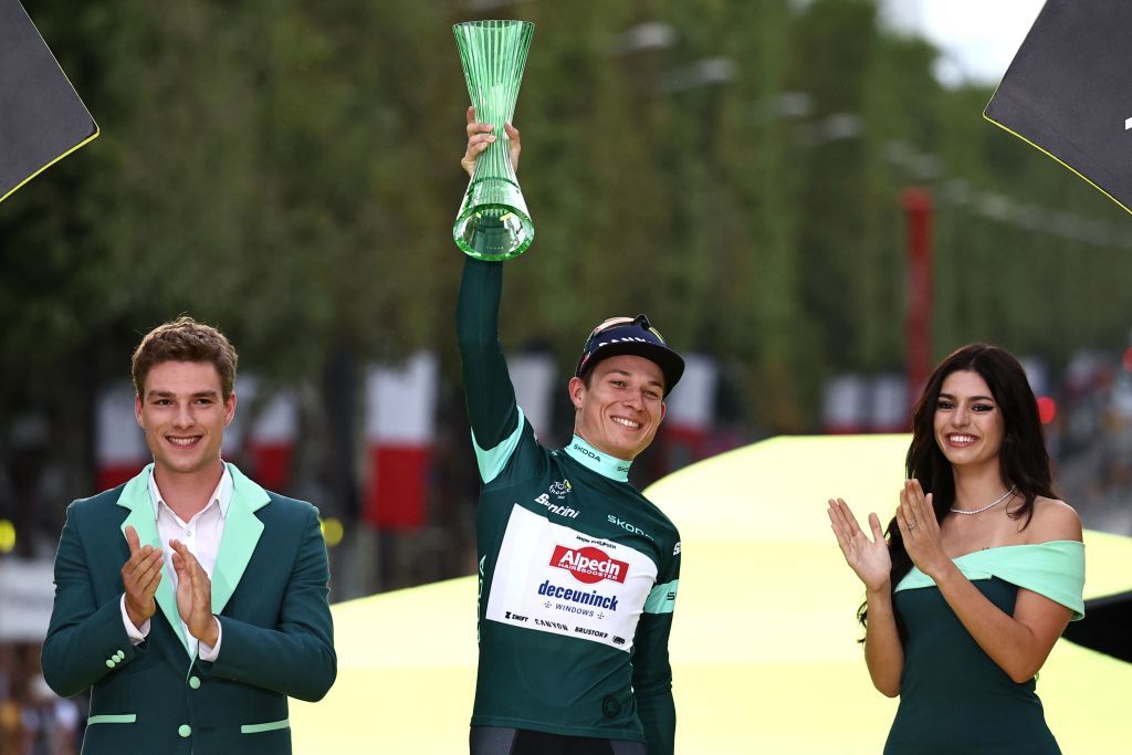 AlpecinDeceunincks Belgian rider Jasper Philipsen celebrates on the podium with the best sprinters green jersey after the 21st and final stage of the 110th edition of the Tour de France cycling race 115 km between SaintQuentinenYvelines and the ChampsElysees in Paris on July 23 2023 Photo by AnneChristine POUJOULAT AFP Photo by ANNECHRISTINE POUJOULATAFP via Getty Images