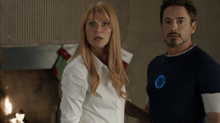 Pepper and Tony in Iron Man 3 with a stocking in the background