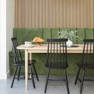 dining room with green bench