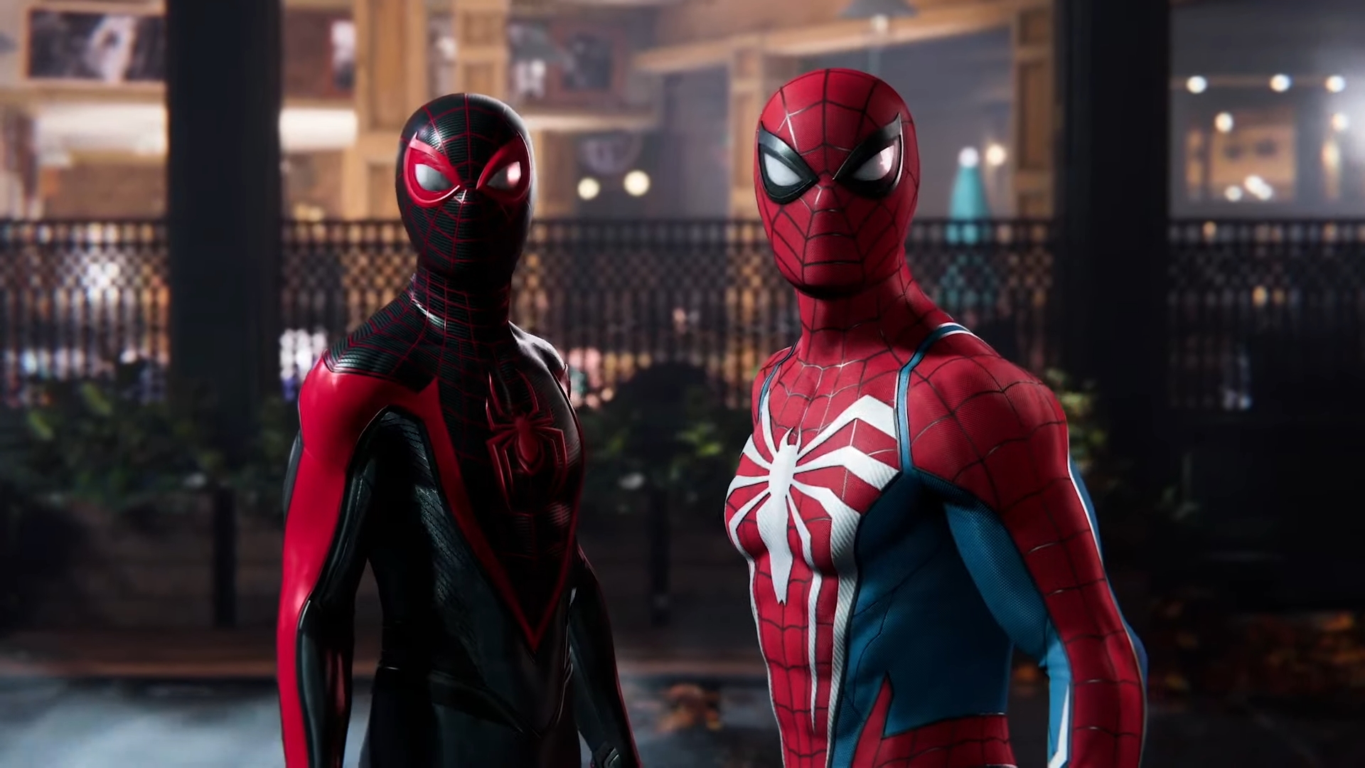 Screenshot of Marvel's Spider-Man 2 showing Peter Parker and Miles Morales side by side in their respective Spider-Man costumes