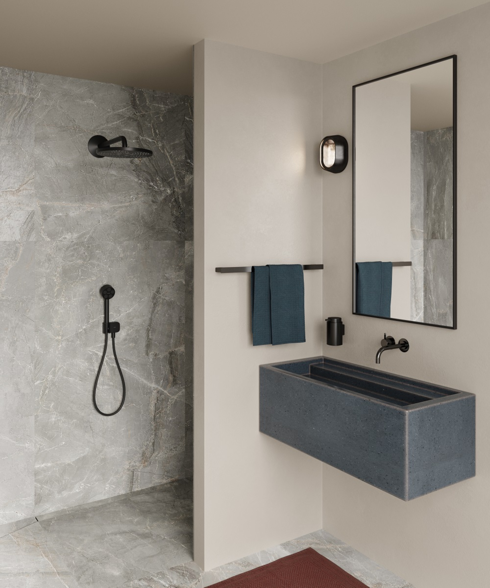 modern bathroom wetroom with cream walls, marbled floor and shower walls, grey trough like sink, simple towel rail and mirror above sink