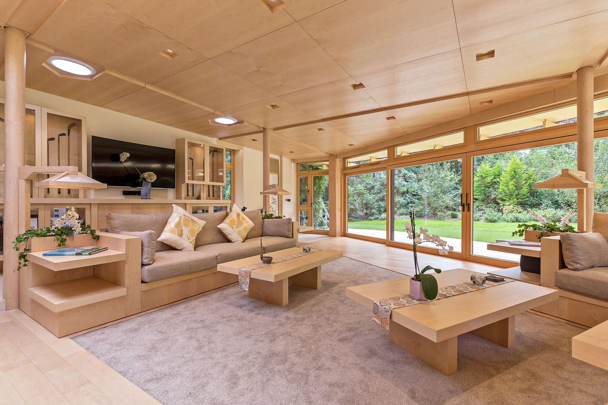 A view of the living room with sliding glass doors leading out to the garden