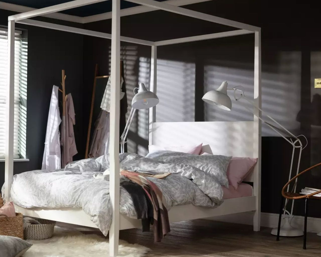 Habitat Blissford Four Poster Kingsize Bed Frame in white inside dark room with two large floor lamps either side