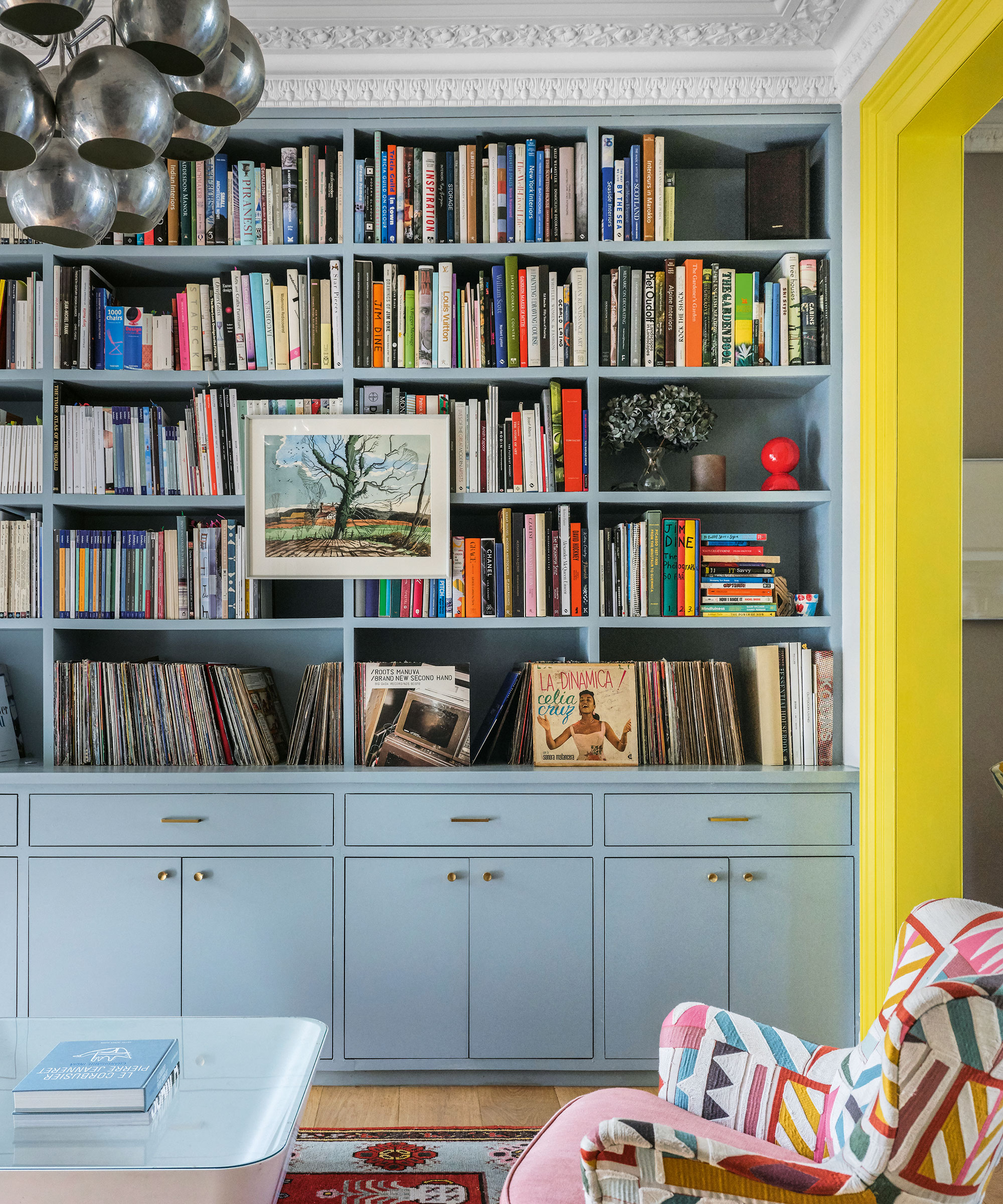 Living room with blue bespoke shelving