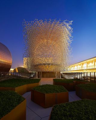 Uk Pavilion by night in gold