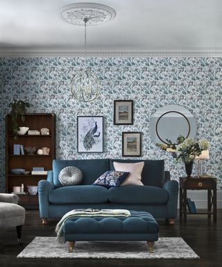 Evie mirror idea by Laura Ashley in living room with teal sofa and chesterfield-style footrest