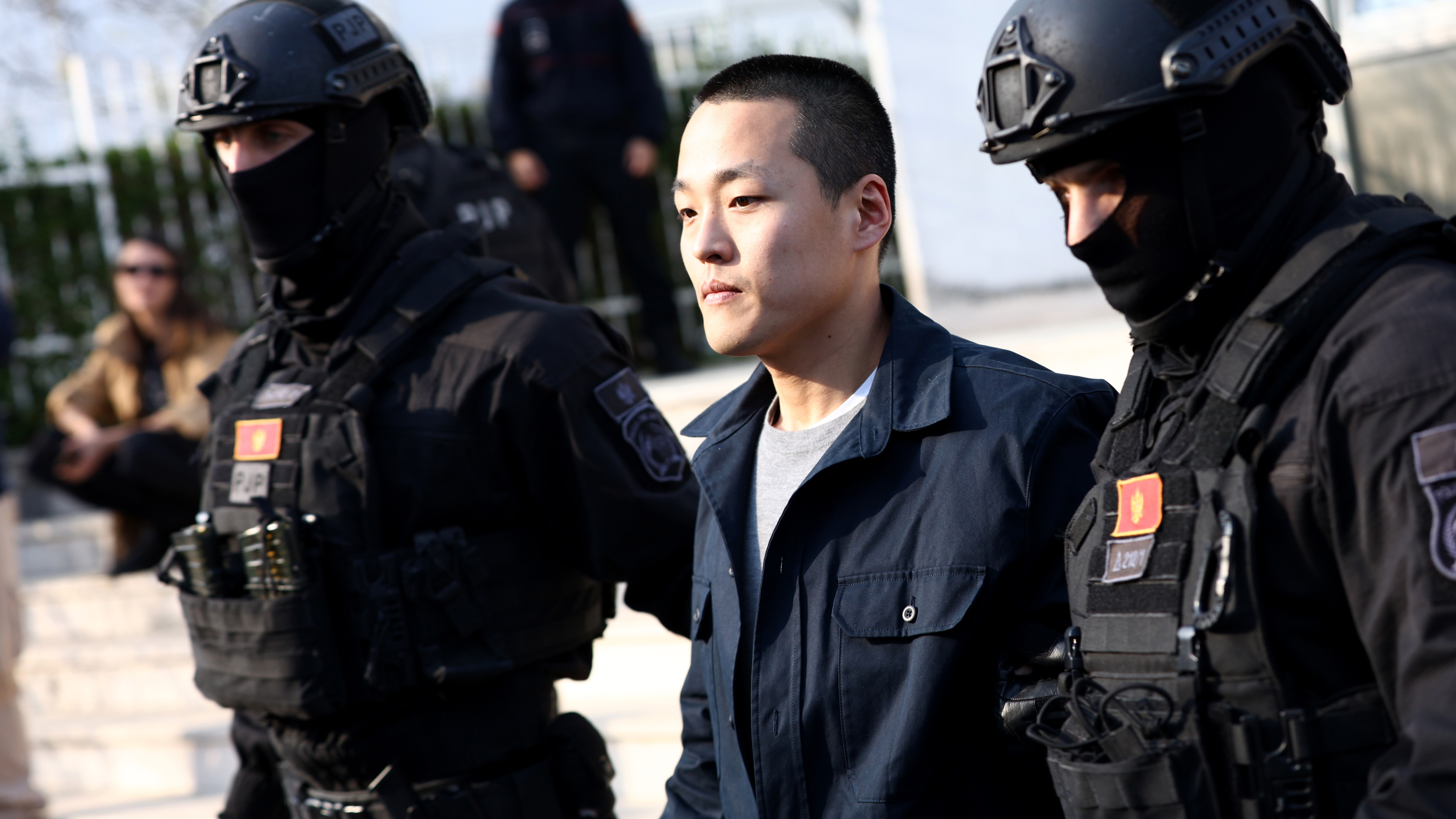PODGORICA, MONTENEGRO - MARCH 23: Police officers escort Do Kwon after he served sentence in prison for document forgery on March 23, 2024 in Podgorica, Montenegro. 