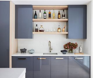 home bar in kitchen with blue gray cabinets