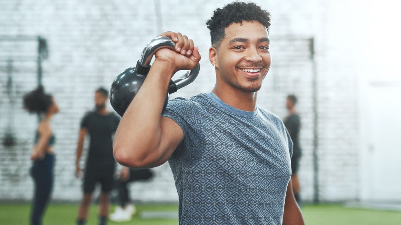 A man holding a kettlebell