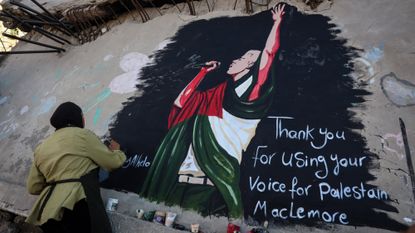 Mural honors US rapper Macklemore for solidarity with Palestinians in GazaGAZA CITY, GAZA, PALESTINE - SEPTEMBER 17: A Palestinian artist paints a mural of US rapper Macklemore on the wall of a destroyed house in Gaza City to thank him for expressing support for Palestinians in the Gaza Strip, Gaza, Palestine, on September 17, 2026. The mural expresses love and gratitude for Macklemore's solidarity with the Palestinian people. (Photo by Abdalhkem Abu Riash/Anadolu via Getty Images)