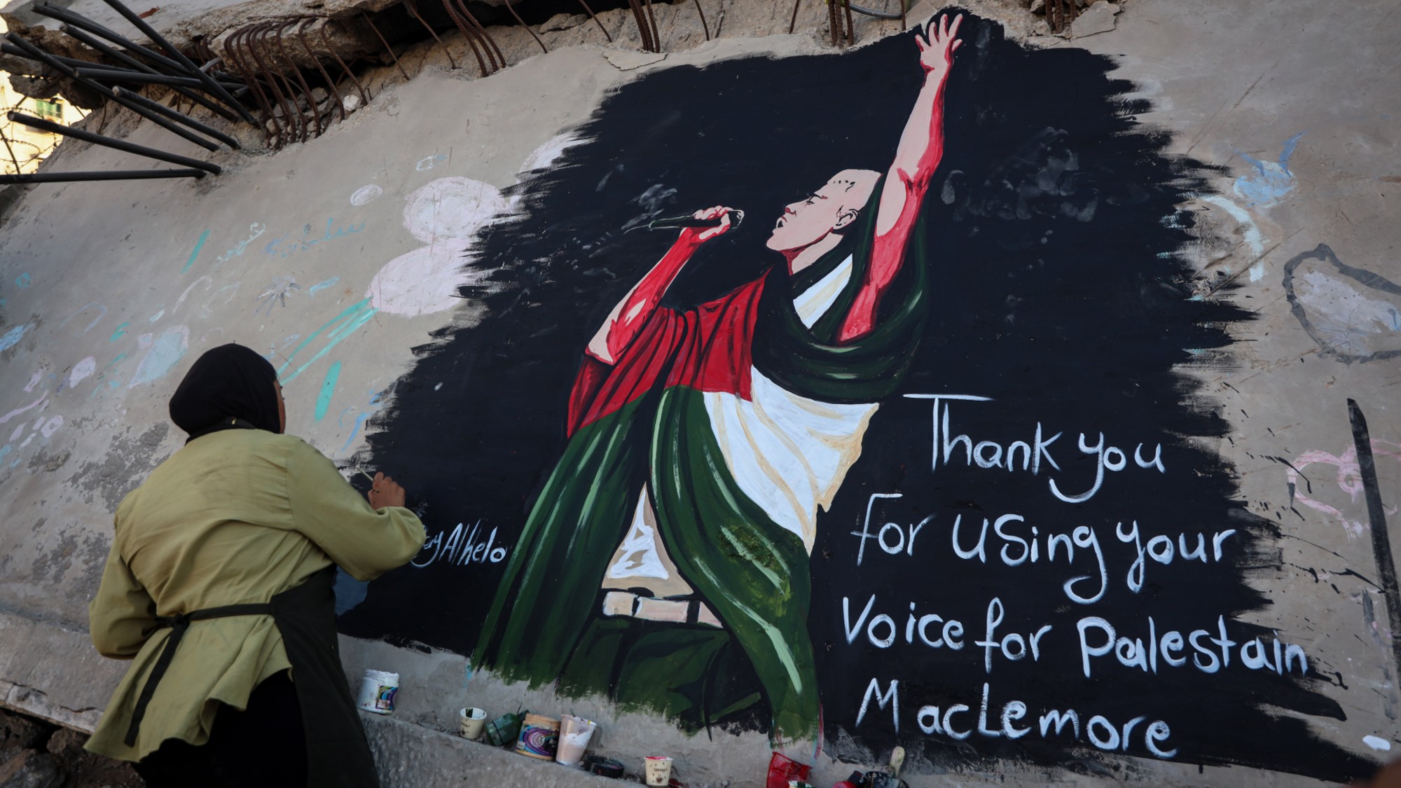Mural honors US rapper Macklemore for solidarity with Palestinians in GazaGAZA CITY, GAZA, PALESTINE - SEPTEMBER 17: A Palestinian artist paints a mural of US rapper Macklemore on the wall of a destroyed house in Gaza City to thank him for expressing support for Palestinians in the Gaza Strip, Gaza, Palestine, on September 17, 2026. The mural expresses love and gratitude for Macklemore's solidarity with the Palestinian people. (Photo by Abdalhkem Abu Riash/Anadolu via Getty Images)
