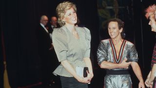 Princess Diana smiling stood next to Wayne Sleep who is wearing a deep-v dance costume