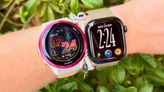a photo of the Apple Watch Series 12 and Garmin Forerunner 570