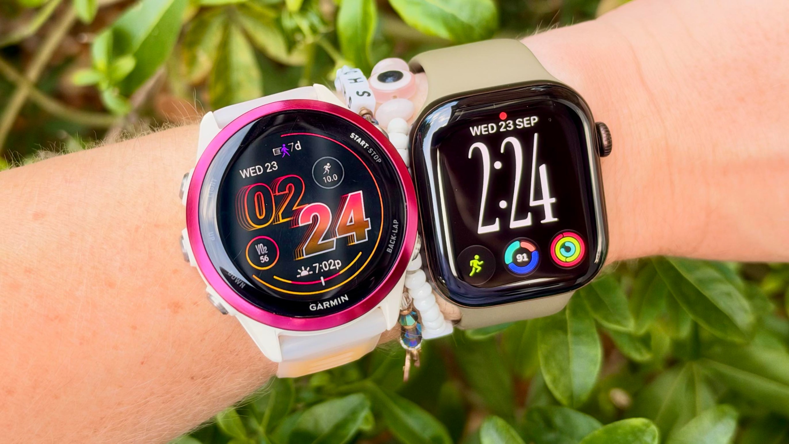 a photo of the Apple Watch Series 12 and Garmin Forerunner 570