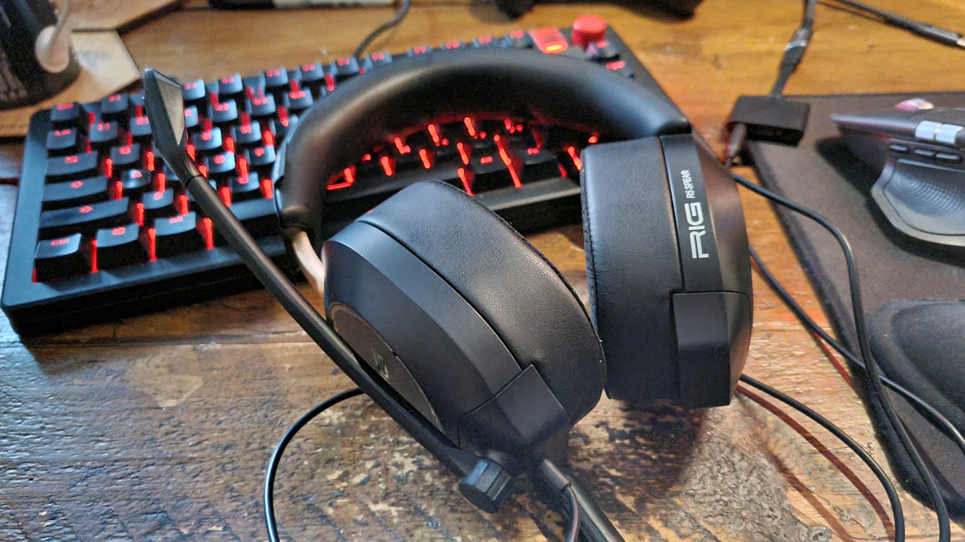 A Rig R5 Spear Max HD gaming headset resting on a gaming keyboard